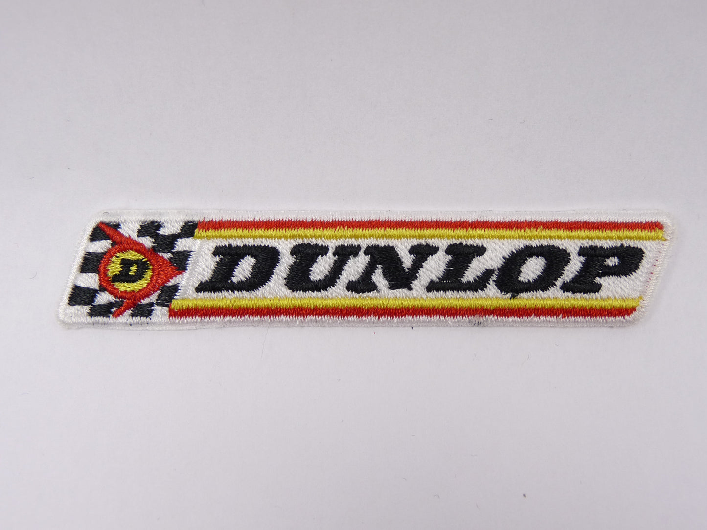 PTC52 Patch brodé thermocollé : logo Dunlop largeur environ 10 cm hauteur environ 1.9 cm