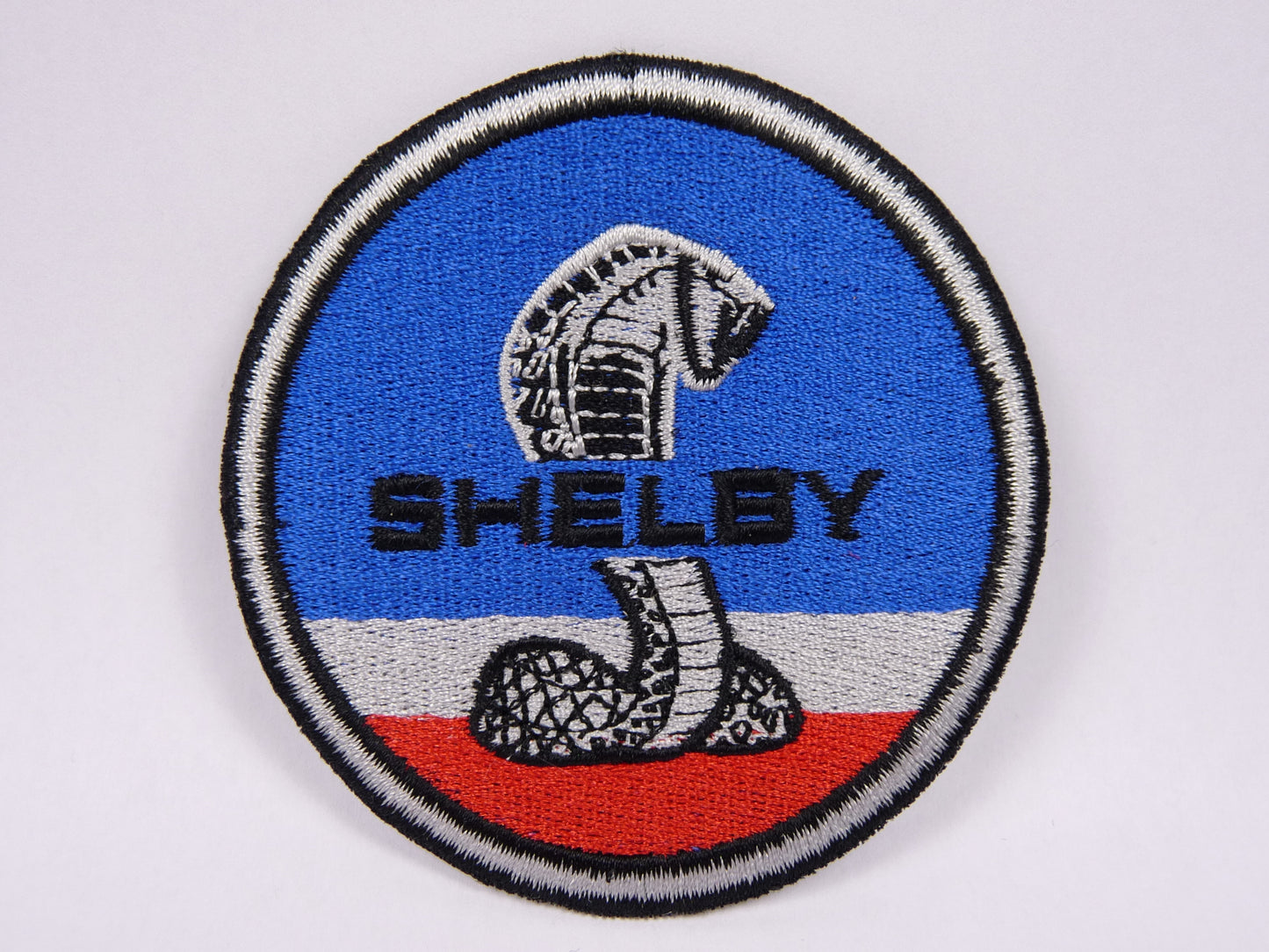 PTC128 Patch brodé thermocollé : logo Shelby Diamètre environ 7.9 cm